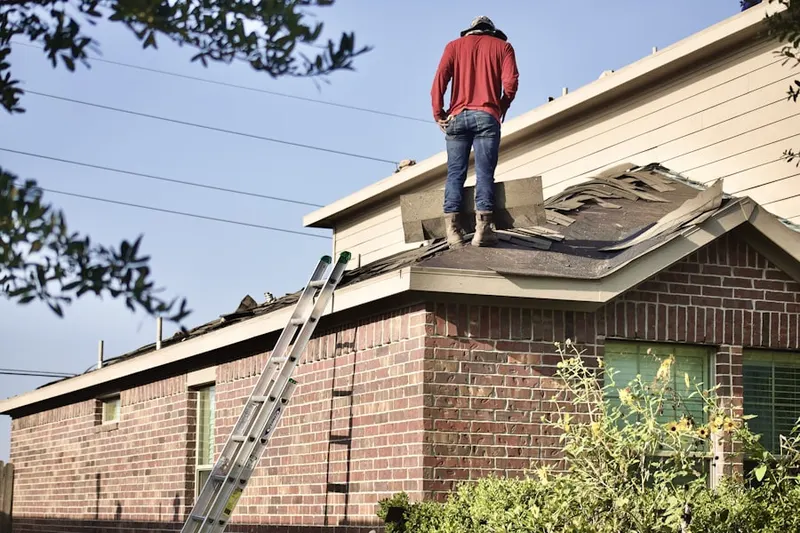 Professional roofer working on a residential roof in Tahoe Vista